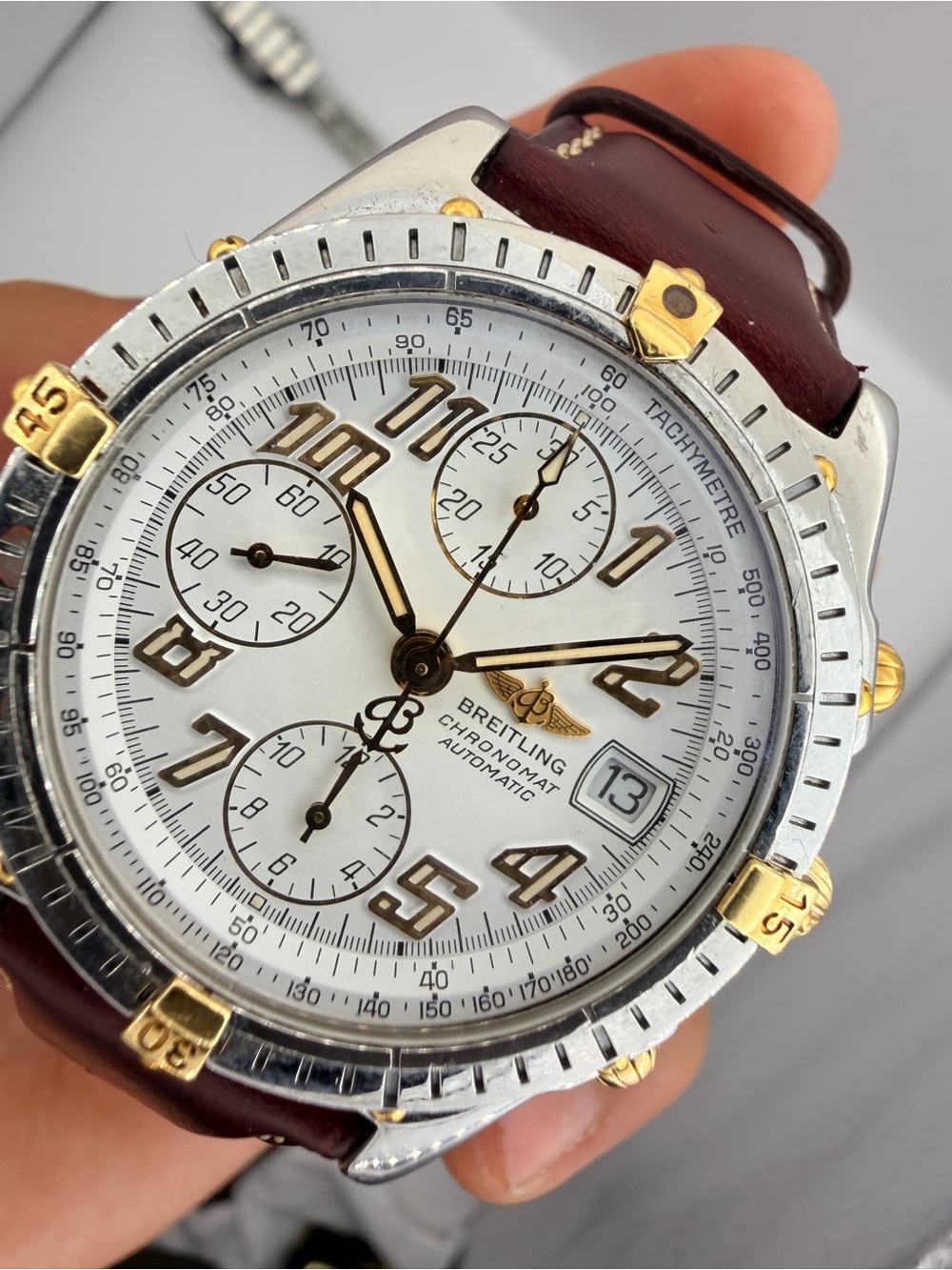 Breitling Two-Tone Silver and Gold Chronograph Watch with Brown Strap